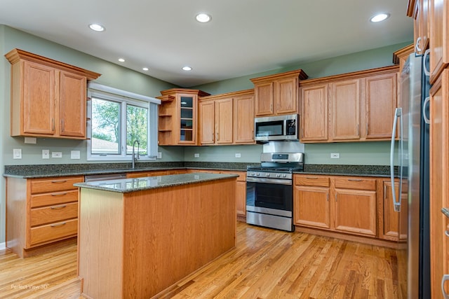 573 W Babcock Ave, Elmhurst, IL 60126 - kitchen with appliances with stainless steel finishes, a sink, light wood-style flooring, recessed lighting, and dark stone counters