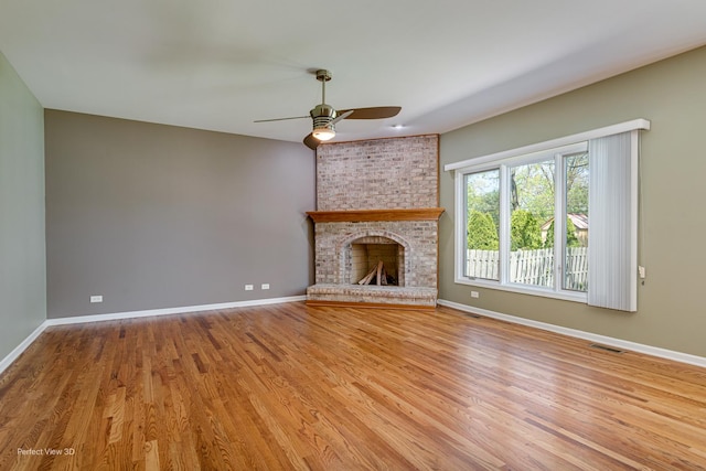 573 W Babcock Ave, Elmhurst, IL 60126 - unfurnished living room featuring a ceiling fan, baseboards, and wood finished floors
