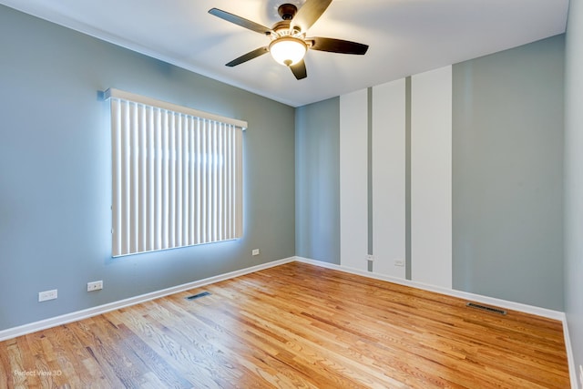 573 W Babcock Ave, Elmhurst, IL 60126 - empty room featuring ceiling fan, wood finished floors, and baseboards