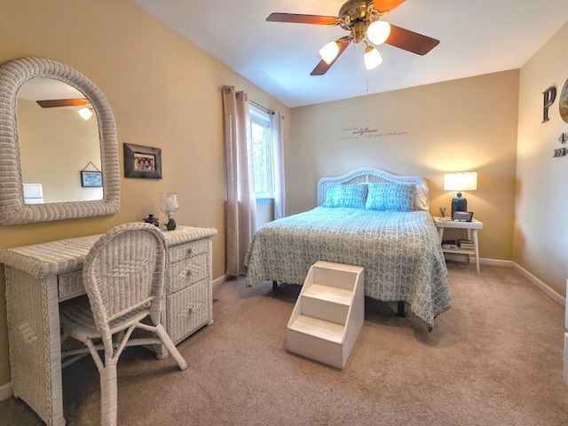 bedroom with baseboards, ceiling fan, and light carpet