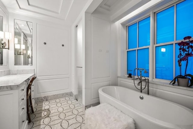 full bathroom featuring vanity and a freestanding tub
