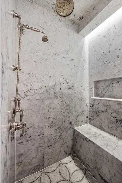 bathroom with a tile shower