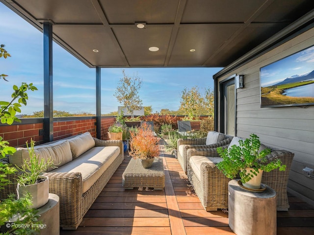 wooden terrace featuring an outdoor hangout area