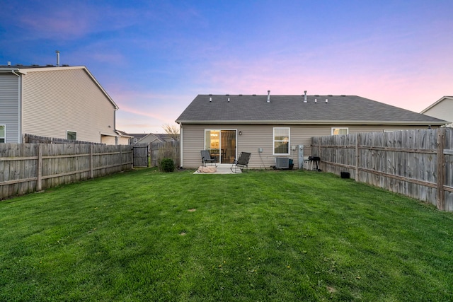 733 Florence St, Hampshire, IL 60140 - back of property featuring central AC, a patio, a fenced backyard, roof with shingles, and a lawn