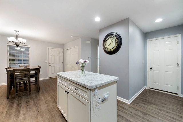 733 Florence St, Hampshire, IL 60140 - kitchen with baseboards, white cabinets, wood finished floors, and a chandelier