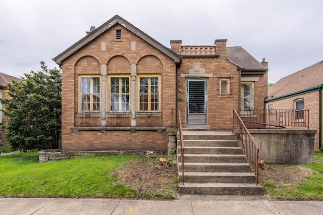 3237 W 83rd Pl, Chicago, IL 60652 - view of front of property featuring a chimney, brick siding, and a front lawn