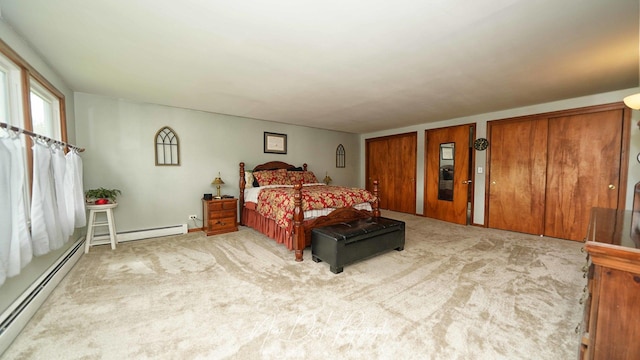 23233 W N Lakewood Ln, Lake Zurich, IL 60047 - bedroom featuring multiple closets, a baseboard heating unit, and carpet flooring
