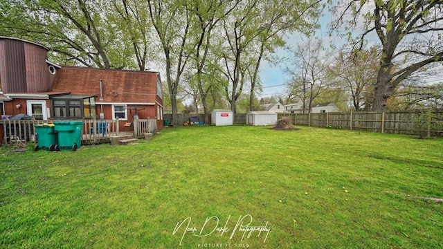 23233 W N Lakewood Ln, Lake Zurich, IL 60047 - view of yard featuring a fenced backyard, a storage unit, an outdoor structure, and a deck