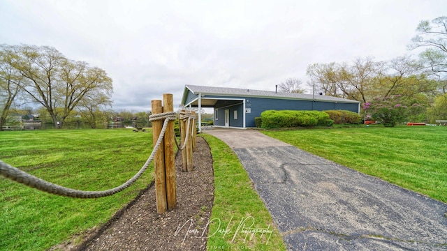 23233 W N Lakewood Ln, Lake Zurich, IL 60047 - view of front of property with a front lawn, driveway, and an attached carport