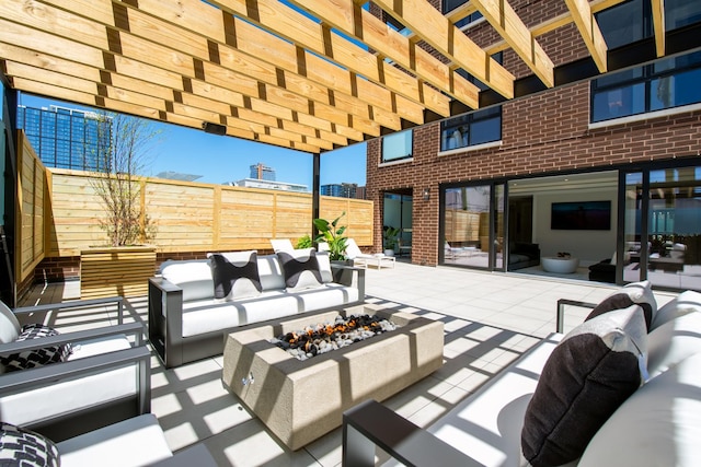 view of patio with an outdoor living space with a fire pit, fence, and a pergola