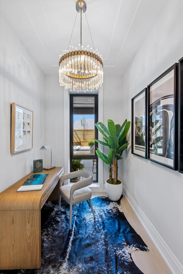 office area featuring baseboards, an inviting chandelier, and visible vents