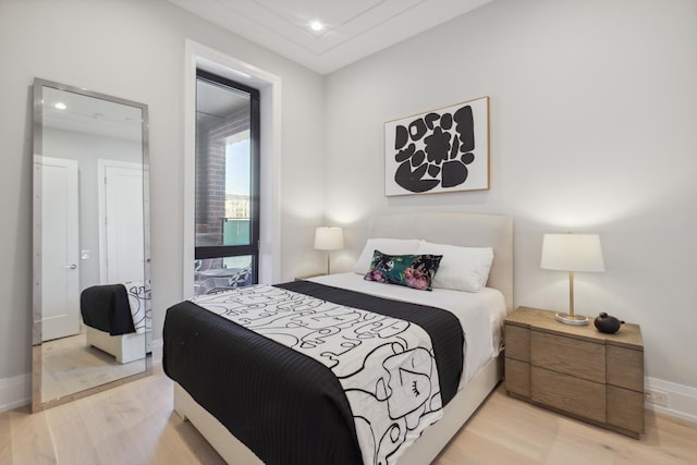 bedroom featuring recessed lighting, baseboards, and light wood-type flooring
