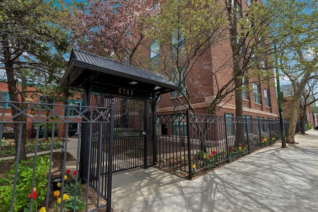 exterior space with fence and a gate