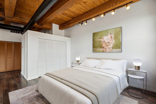 bedroom featuring wooden ceiling, a closet, rail lighting, and visible vents
