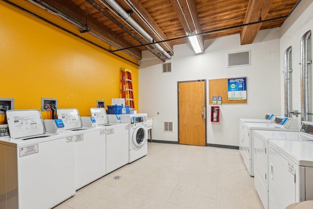 common laundry area featuring wooden ceiling, baseboards, independent washer and dryer, and visible vents