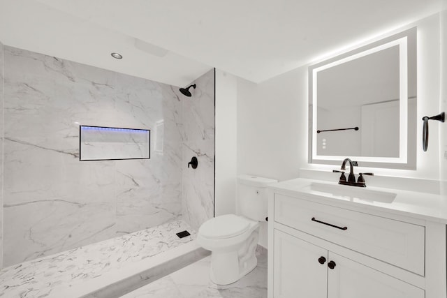 full bathroom featuring toilet, a marble finish shower, marble finish floor, and vanity
