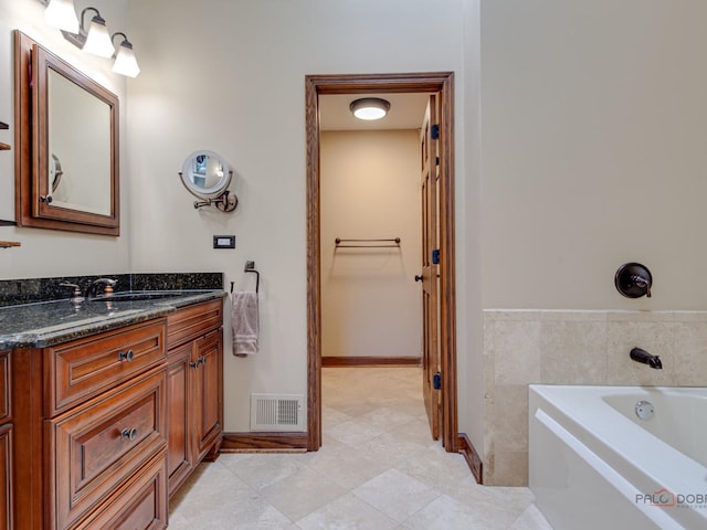 1341 N Home Ct, Palatine, IL 60074 - bathroom featuring vanity, a bath, tile patterned flooring, and baseboards