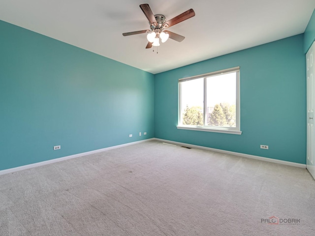 1341 N Home Ct, Palatine, IL 60074 - carpeted spare room featuring ceiling fan and baseboards
