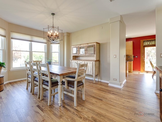 1341 N Home Ct, Palatine, IL 60074 - dining space with light wood-style flooring, a chandelier, and baseboards