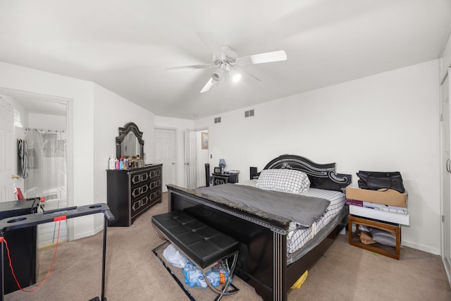 carpeted bedroom featuring baseboards, ceiling fan, and visible vents