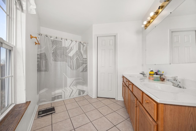 4221 Brentwood Ln, Waukegan, IL 60087 - bathroom with double vanity, tile patterned floors, a wealth of natural light, and a sink
