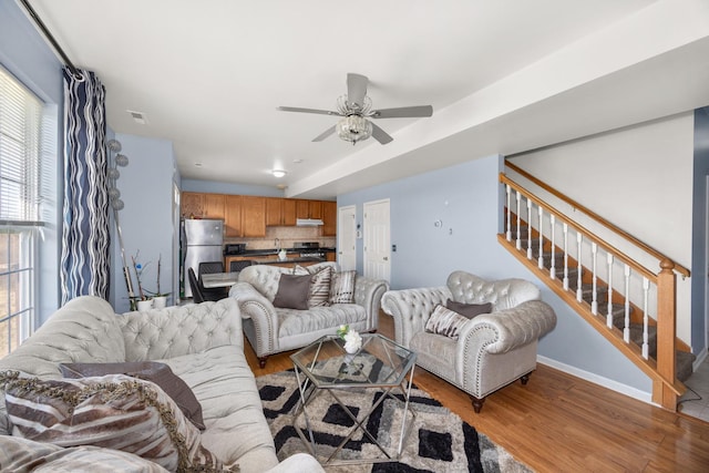 4221 Brentwood Ln, Waukegan, IL 60087 - living area with ceiling fan, light wood finished floors, visible vents, and stairs