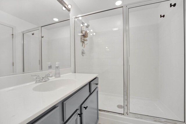 full bath featuring a shower stall and vanity