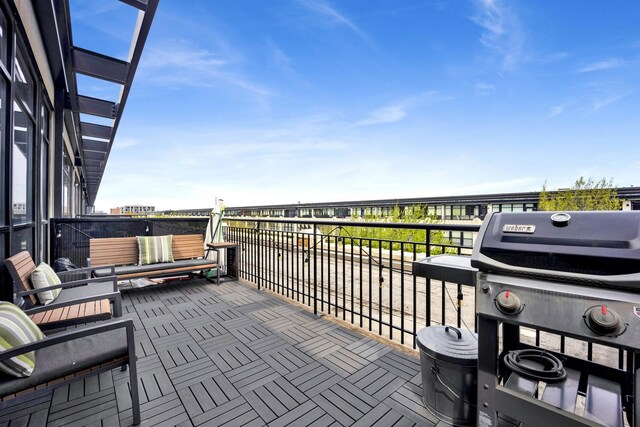 exterior space with grilling area and a balcony