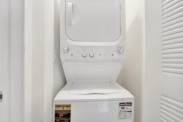 laundry area featuring laundry area and stacked washing maching and dryer