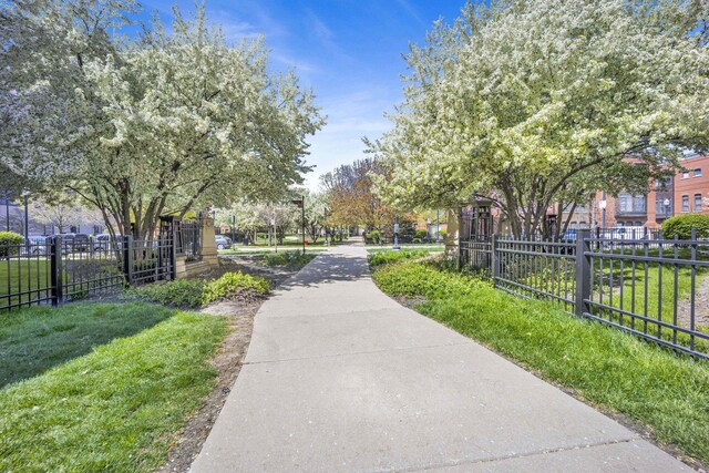 view of home's community with fence