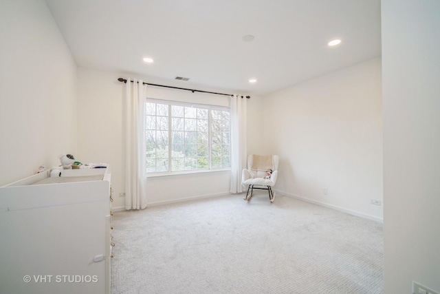 living area with baseboards, carpet, and recessed lighting