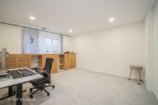 office space with recessed lighting, baseboards, and light carpet