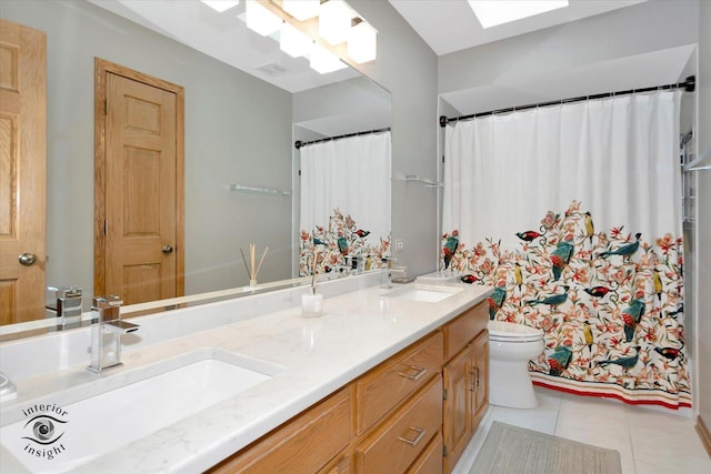 full bath featuring a sink, tile patterned flooring, toilet, and double vanity