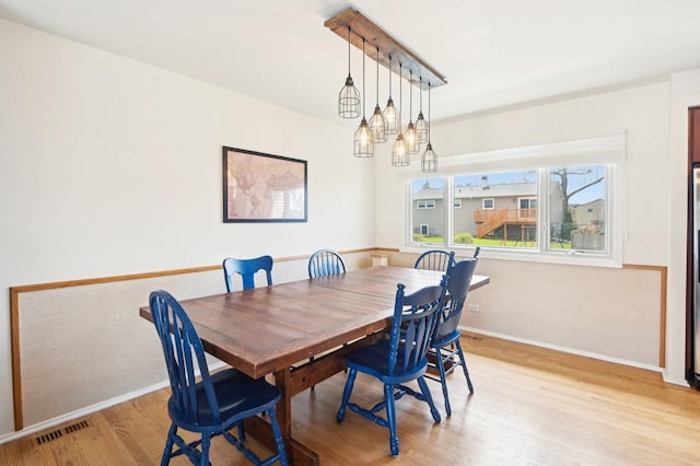 4569 Gettysburg Dr, Rolling Meadows, IL 60008 - dining space with baseboards, light wood-style flooring, and visible vents