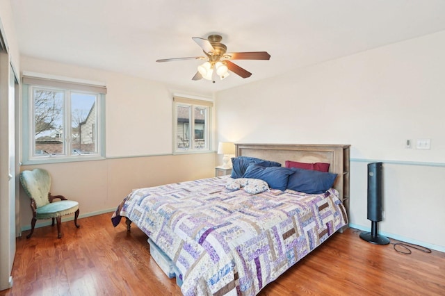 4569 Gettysburg Dr, Rolling Meadows, IL 60008 - bedroom with a ceiling fan, baseboards, and wood finished floors