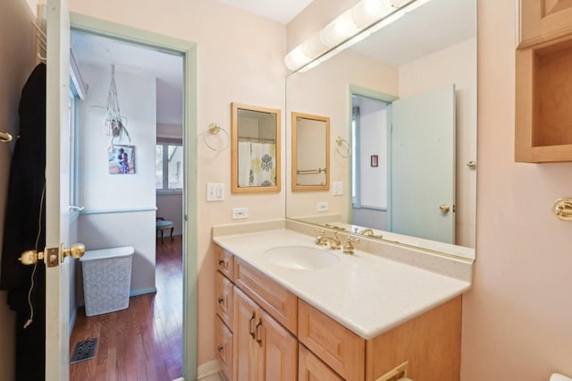 4569 Gettysburg Dr, Rolling Meadows, IL 60008 - bathroom with vanity, wood finished floors, and visible vents