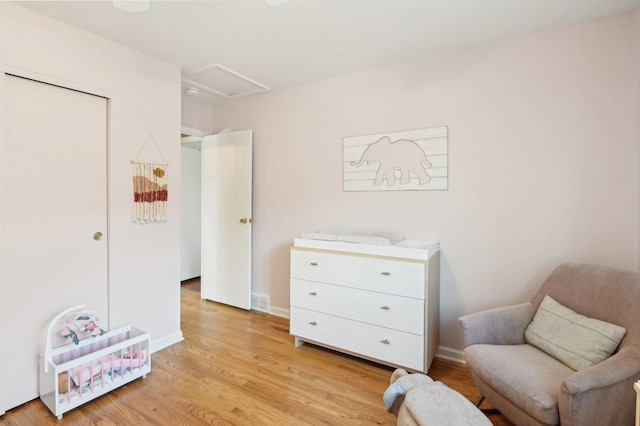 4569 Gettysburg Dr, Rolling Meadows, IL 60008 - living area with light wood-style floors, attic access, and baseboards