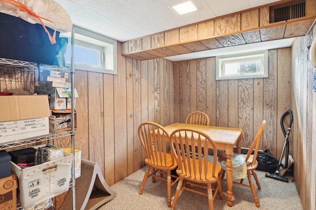 4569 Gettysburg Dr, Rolling Meadows, IL 60008 - carpeted dining area featuring visible vents, wooden walls, and a wealth of natural light