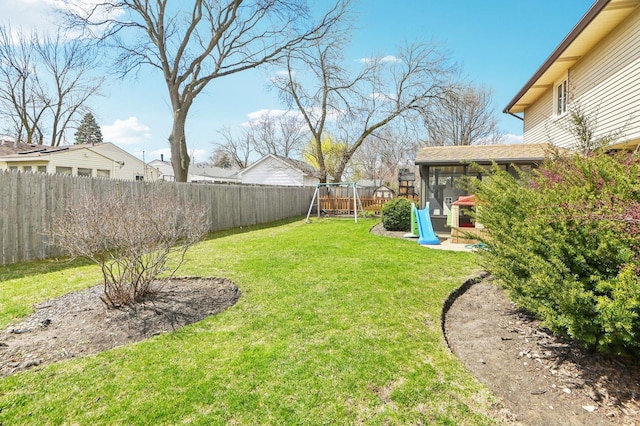 4569 Gettysburg Dr, Rolling Meadows, IL 60008 - view of yard with a playground, a sunroom, and a fenced backyard