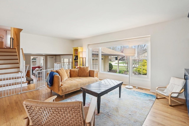 4569 Gettysburg Dr, Rolling Meadows, IL 60008 - living area featuring stairway, wood finished floors, and visible vents