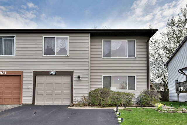 1923 Windward Ln Unit 1923, Hanover Park, IL 60133 - view of front of property featuring a garage and aphalt driveway