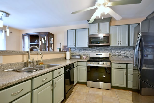 1923 Windward Ln Unit 1923, Hanover Park, IL 60133 - kitchen with decorative backsplash, light tile patterned flooring, ceiling fan, a sink, and black appliances