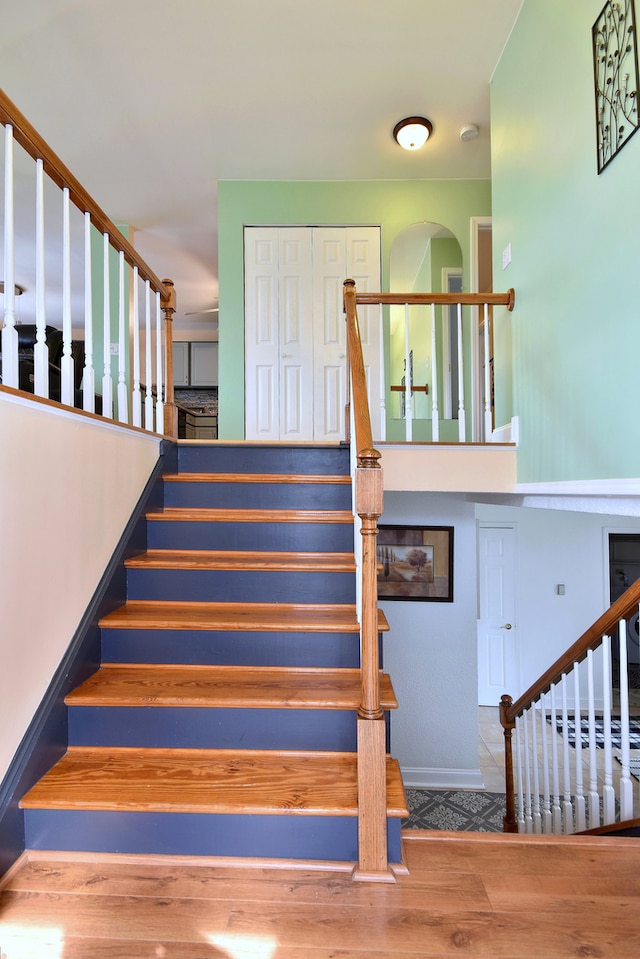 staircase with wood finished floors
