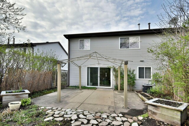 1923 Windward Ln Unit 1923, Hanover Park, IL 60133 - back of house featuring fence, a patio, and central AC