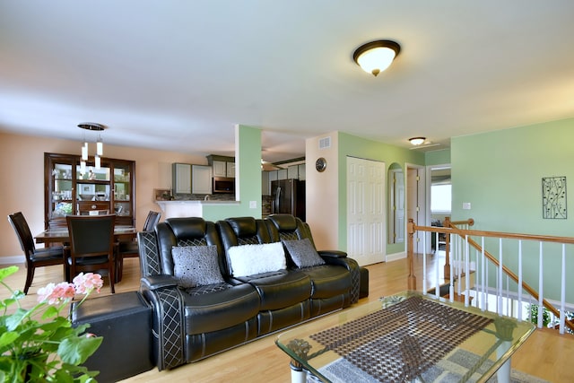 1923 Windward Ln Unit 1923, Hanover Park, IL 60133 - living area featuring light wood-type flooring and baseboards