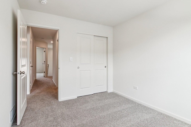 6343 Ulster Dr, Tinley Park, IL 60477 - unfurnished bedroom with baseboards, carpet, and a closet