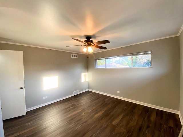 unfurnished room with visible vents, baseboards, and dark wood-type flooring