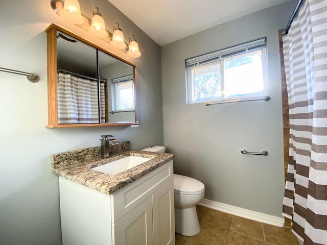 bathroom with vanity, curtained shower, toilet, baseboards, and tile patterned floors