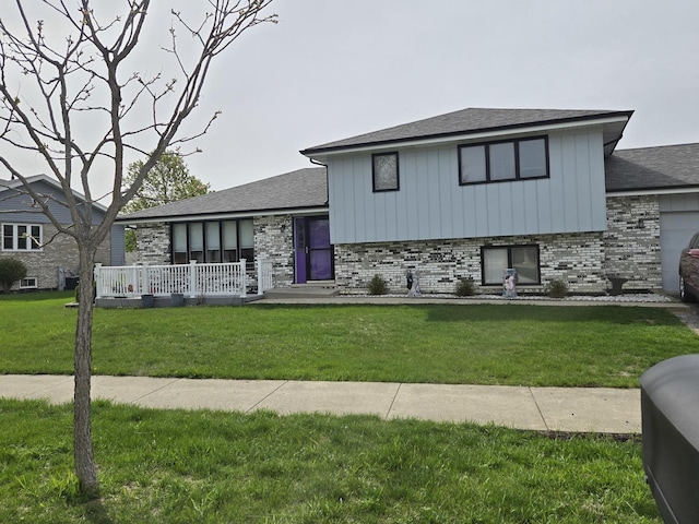 8919 Meadowview Dr, Orland Hills, IL 60487 - tri-level home with board and batten siding, brick siding, and a front lawn
