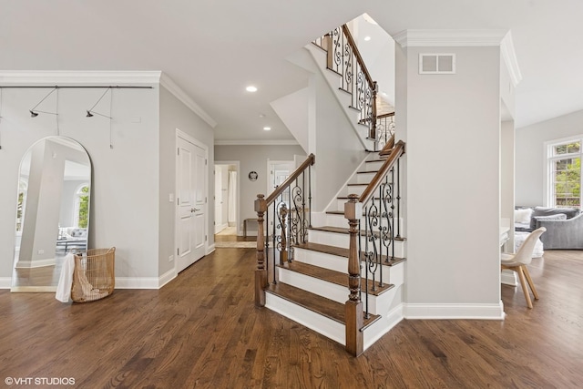410 W 2nd St, Elmhurst, IL 60126 - stairs with visible vents, arched walkways, wood finished floors, baseboards, and ornamental molding